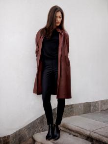 Female Model standing on steps wearing a full look by Annette Görtz